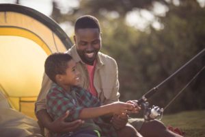 Father and son fishing outdoors