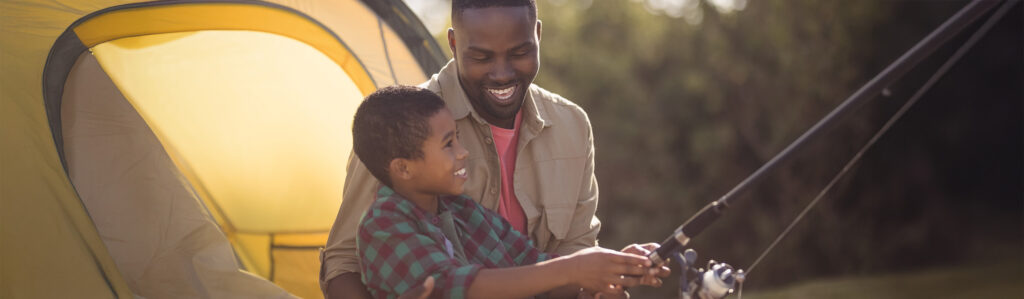 Father and son fishing outdoors
