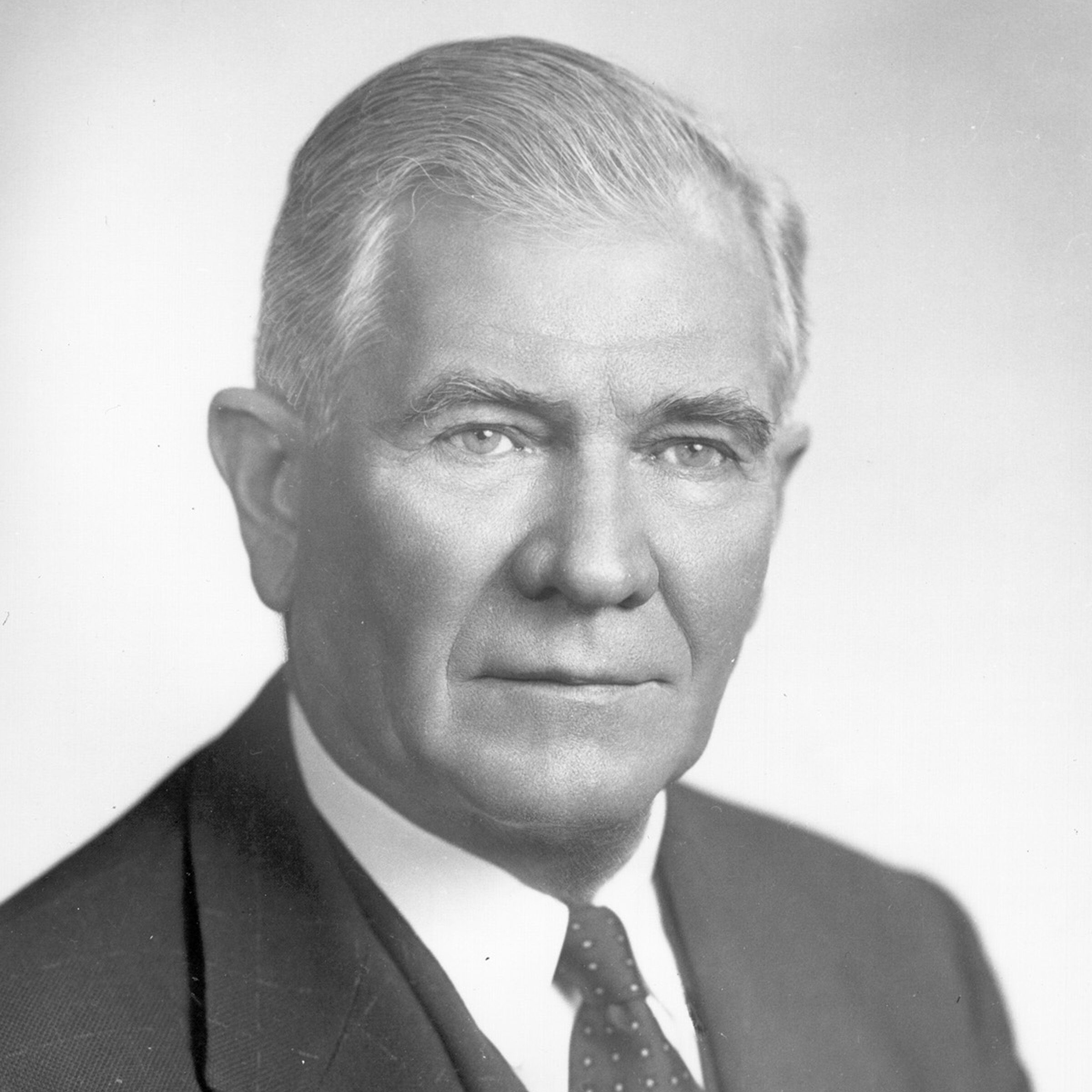 A black and white photograph of Absalom Willis Robertson wearing a fine suit and posing for the camera.